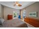 Bright bedroom featuring wood floors and a lanai at 11910 Soft Rush Ter, Lakewood Ranch, FL 34202