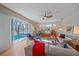 Spacious living room with pool view, modern furniture, and lots of natural light at 11910 Soft Rush Ter, Lakewood Ranch, FL 34202
