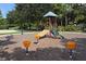 Community playground area with swings, slides, and other playground equipment at 11910 Soft Rush Ter, Lakewood Ranch, FL 34202