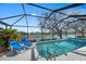 Screened-in pool overlooking serene waterfront at 11910 Soft Rush Ter, Lakewood Ranch, FL 34202