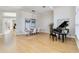Bright dining room with hardwood floors, stylish lighting, and ample space for elegant gatherings at 121 N Boulevard Of Presidents, Sarasota, FL 34236