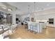 Modern kitchen with quartz countertops, pendant lighting, and an open layout connecting to the living area at 121 N Boulevard Of Presidents, Sarasota, FL 34236