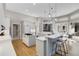 Contemporary kitchen featuring a center island, ample counter space, and stylish pendant lighting fixtures at 121 N Boulevard Of Presidents, Sarasota, FL 34236