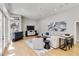 Bright living room with high ceilings, comfortable seating, a stylish rug, and a view through french doors at 121 N Boulevard Of Presidents, Sarasota, FL 34236