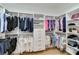 Spacious walk-in closet with custom shelving and hanging rods, offering ample storage space at 121 N Boulevard Of Presidents, Sarasota, FL 34236