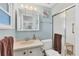 Bathroom with shower, updated sink, and vanity with storage at 1210 44Th Avenue E Dr, Ellenton, FL 34222