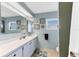 Bathroom with a white countertop vanity and decorative wall art at 1210 44Th Avenue E Dr, Ellenton, FL 34222