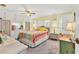 Cozy bedroom with bright walls, ceiling fan, carpet, and natural light at 1210 44Th Avenue E Dr, Ellenton, FL 34222