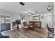 Dining room with wood-style floors, ceiling fan, and stylish decor at 1210 44Th Avenue E Dr, Ellenton, FL 34222