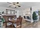 Bright dining area with wood-style floors adjacent to the kitchen at 1210 44Th Avenue E Dr, Ellenton, FL 34222