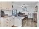 Charming dining area featuring granite countertops, table with chairs, and a fireplace at 1210 44Th Avenue E Dr, Ellenton, FL 34222