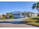 Charming single-story home with a well-maintained front yard and a covered porch, creating a welcoming curb appeal at 1210 44Th Avenue E Dr, Ellenton, FL 34222
