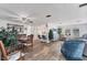 Open-concept living area with modern flooring, comfortable seating, and a seamless flow to the kitchen and dining space at 1210 44Th Avenue E Dr, Ellenton, FL 34222