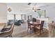 Spacious living area with wood-style floors, ceiling fan, and stylish decor at 1210 44Th Avenue E Dr, Ellenton, FL 34222
