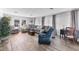 Spacious living room featuring comfortable seating, large windows, and modern flooring, creating a welcoming atmosphere at 1210 44Th Avenue E Dr, Ellenton, FL 34222