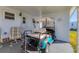 Covered patio with a golf cart parked, offering shade and convenience at 1210 44Th Avenue E Dr, Ellenton, FL 34222