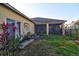 Manicured backyard with screened-in patio and well-maintained lawn at 12286 23Rd E St, Parrish, FL 34219