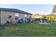 Landscaped backyard with outdoor seating area at 12286 23Rd E St, Parrish, FL 34219