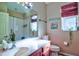 Cozy bathroom with a shower and tub combo, vanity, toilet, and decor with a modern and clean design at 12286 23Rd E St, Parrish, FL 34219