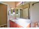 Bathroom featuring a large mirror, spacious vanity, and great lighting for daily routines at 12286 23Rd E St, Parrish, FL 34219
