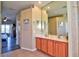 Bathroom featuring a double sink vanity with wood cabinets and an expansive mirror, offering ample space at 12286 23Rd E St, Parrish, FL 34219