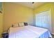 Bedroom features a comfortable bed, closet, and bright, sunny space at 12286 23Rd E St, Parrish, FL 34219