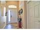 Inviting entryway with a tiled floor, coatrack and decor at 12286 23Rd E St, Parrish, FL 34219