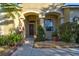 Inviting front entryway with arched alcove, neat landscaping, and a Vivint security system at 12286 23Rd E St, Parrish, FL 34219