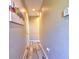 Hallway featuring tile floors, neutral paint, and access to rooms at 12286 23Rd E St, Parrish, FL 34219