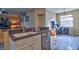 Modern kitchen featuring a breakfast bar, stainless steel appliances, and access to a home office at 12286 23Rd E St, Parrish, FL 34219
