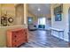 Open-concept living room with wood-look floors and access to the outdoor patio at 12286 23Rd E St, Parrish, FL 34219