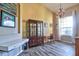 Living room featuring wood-look tile flooring, hutch, desk, chair, and natural light at 12286 23Rd E St, Parrish, FL 34219