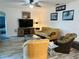 Bright living room featuring furniture, decor, tile floors, and a ceiling fan at 12286 23Rd E St, Parrish, FL 34219