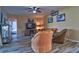 Comfortable living room with ceiling fan, media center with fireplace, and stylish tile floors at 12286 23Rd E St, Parrish, FL 34219