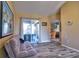 Living room featuring sliding glass doors, hardwood floors, and views to other rooms at 12286 23Rd E St, Parrish, FL 34219