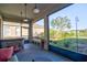 Relaxing screened patio with a hot tub and lush backyard view at 12286 23Rd E St, Parrish, FL 34219