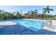 Enjoy the community pool with comfortable lounge chairs and mature landscaping at 12286 23Rd E St, Parrish, FL 34219