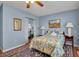 Serene bedroom featuring a floral bedspread, hardwood floors, and a closet with mirrored doors at 1301 58Th W St, Bradenton, FL 34209