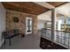 Charming entryway featuring brick accents, a bench, and view of the garage and waterfront beyond at 14 Tidy Island Blvd, Bradenton, FL 34210