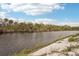 A calm riverbank perfect for fishing, kayaking, or a leisurely stroll at 14912 Sora Way, Bradenton, FL 34212