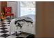 Bedroom close up with black and white floors overlooking the pool at 1510 Lena Ln, Sarasota, FL 34240