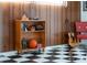 Bedroom with built-in shelving units, guitar, and checkerboard floors at 1510 Lena Ln, Sarasota, FL 34240