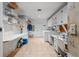 Well-equipped laundry room with washer, dryer, sewing machine, and plenty of storage space at 1510 Lena Ln, Sarasota, FL 34240