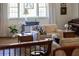 Living area features a neutral sofa, patterned rug, and decorative accents near the window at 1510 Lena Ln, Sarasota, FL 34240