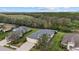 Overhead shot of a home featuring a well-kept lawn and mature trees surrounding the property at 16422 Rivers Reach Blvd, Parrish, FL 34219