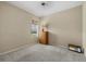 Simple bedroom with neutral walls and carpeting with a large window offering a beautiful view at 16422 Rivers Reach Blvd, Parrish, FL 34219