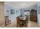 Light-filled dining room with elegant furnishings and a charming china cabinet at 16422 Rivers Reach Blvd, Parrish, FL 34219