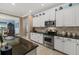 Gourmet kitchen with stainless steel appliances and stone countertops at 16422 Rivers Reach Blvd, Parrish, FL 34219