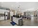 Open concept kitchen with stainless steel appliances overlooking the living area at 16422 Rivers Reach Blvd, Parrish, FL 34219