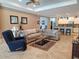 An open concept living room shows the kitchen and breakfast bar at 16422 Rivers Reach Blvd, Parrish, FL 34219